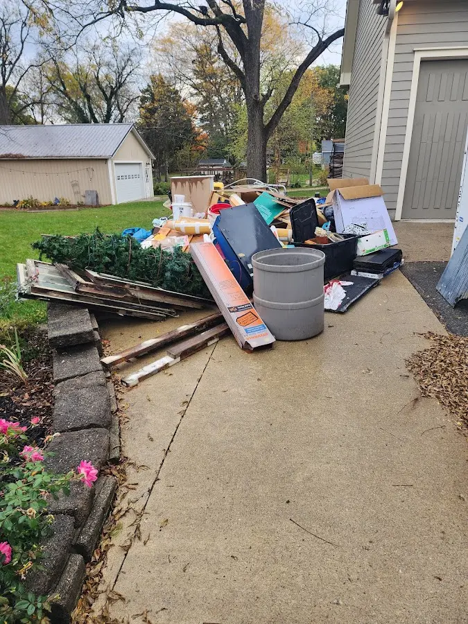 Dumpster being loaded with debris for Residential Dumpster Rental in New Lexington